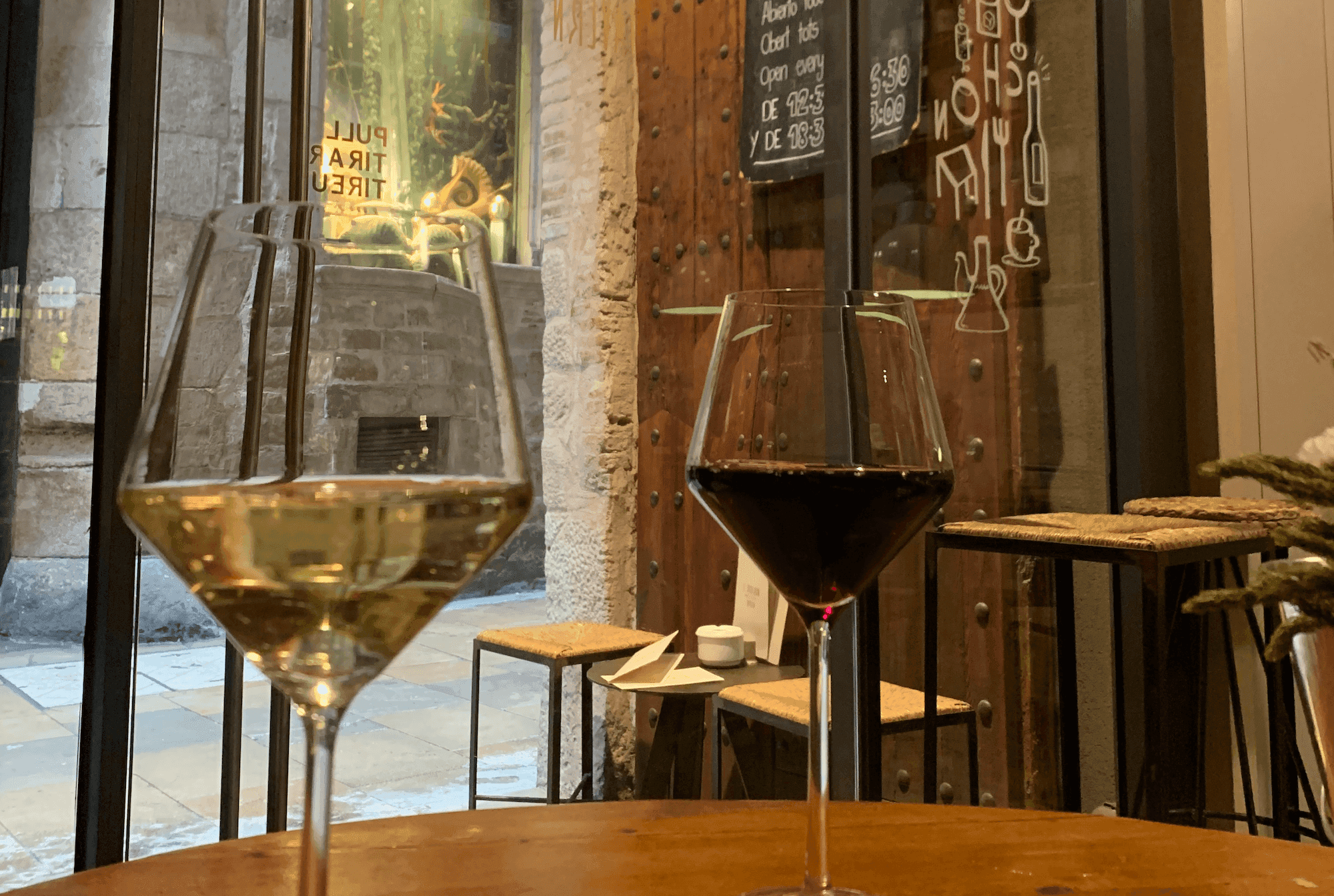 Wine glasses on a table in a small wine bar